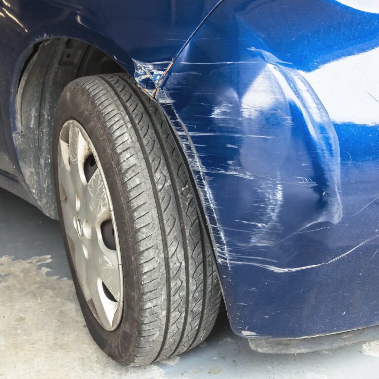 Scratched and dented car. Damaged part of the car in the event of a tamponage or car accident.